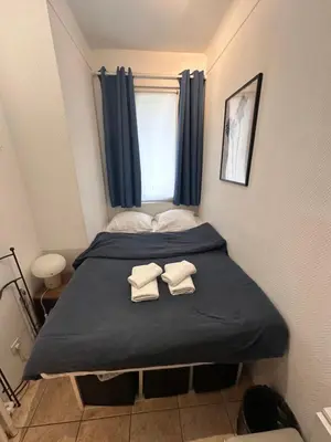 Un ou plusieurs lits dans un hébergement de l'établissement Appartement avec balcon, 5 min du Métro 1-6, Nation, Disneyland, Zoo, Bois de Vincennes