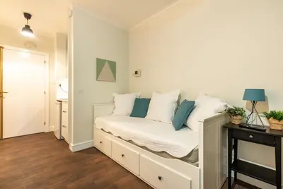 Un ou plusieurs lits dans un hébergement de l'établissement Appartement proche Champs Elysées