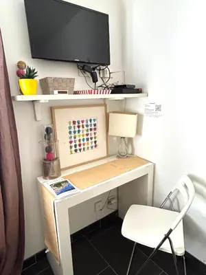 Télévision ou salle de divertissement dans l'établissement Le studio Grenelle
