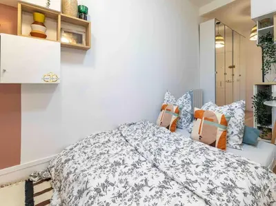 Un ou plusieurs lits dans un hébergement de l'établissement Studio de charme à 2 pas de Paris