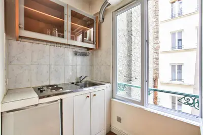 Cuisine ou kitchenette dans l'établissement Charmant studio Paris 3 Marais
