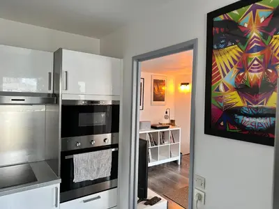 Cuisine ou kitchenette dans l'établissement Cosy Duplex avec Parking à Paris 19 by immo kit bnb