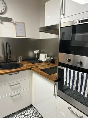 Cuisine ou kitchenette dans l'établissement Cosy Duplex avec Parking à Paris 19 by immo kit bnb