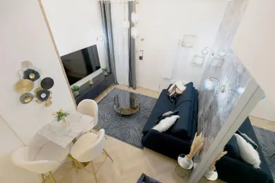 Télévision ou salle de divertissement dans l'établissement Le studio de l'île