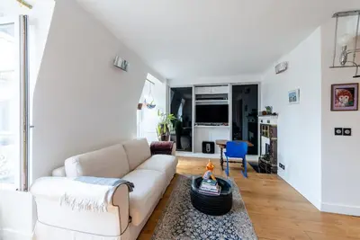Coin salon dans l'établissement Appartement vue Tour Eiffel