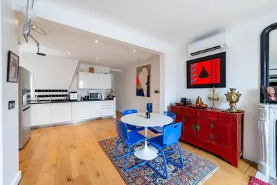 Cuisine ou kitchenette dans l'établissement Appartement vue Tour Eiffel