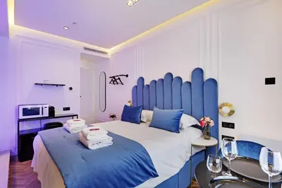 Un ou plusieurs lits dans un hébergement de l'établissement Private suite with jacuzzi - 2P - Rivoli