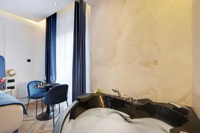 Coin salon dans l'établissement Private suite with jacuzzi - 2P - Rivoli
