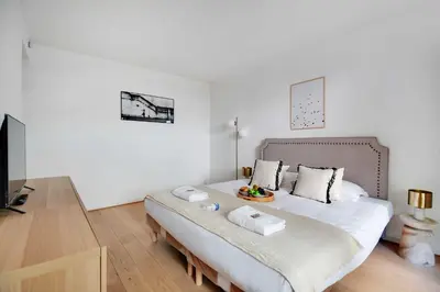 Un ou plusieurs lits dans un hébergement de l'établissement Elegant apartment - 2BR-6P - Tour Eiffel