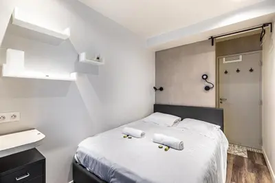 Un ou plusieurs lits dans un hébergement de l'établissement GuestReady - Appt proche du Canal Saint-Martin