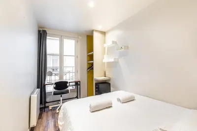 Un ou plusieurs lits dans un hébergement de l'établissement GuestReady - Appt proche du Canal Saint-Martin