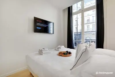 Un ou plusieurs lits dans un hébergement de l'établissement Charming apartment - 3BR-8P - Le Marais