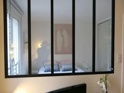 Un ou plusieurs lits dans un hébergement de l'établissement Charme moderne Lantiez CityCosy