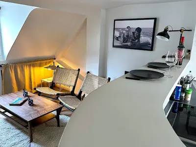 Coin salon dans l'établissement Le Penthouse Picardie