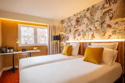Un ou plusieurs lits dans un hébergement de l'établissement Kopster Hotel Paris Porte de Versailles