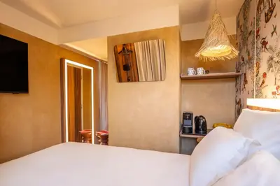 Un ou plusieurs lits dans un hébergement de l'établissement Kopster Hotel Paris Porte de Versailles