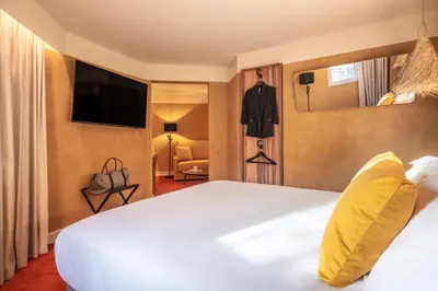 Un ou plusieurs lits dans un hébergement de l'établissement Kopster Hotel Paris Porte de Versailles