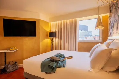 Un ou plusieurs lits dans un hébergement de l'établissement Kopster Hotel Paris Porte de Versailles