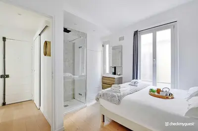 Un ou plusieurs lits dans un hébergement de l'établissement Elegant apartment - 1BR-4P - Les Batignolles