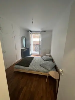 Un ou plusieurs lits dans un hébergement de l'établissement New Entiry apartment-Private rooms in Paris
