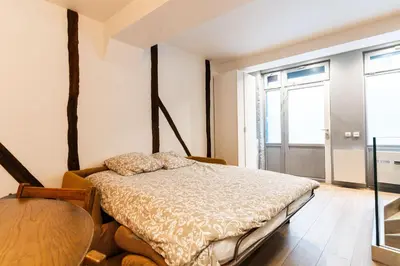 Un ou plusieurs lits dans un hébergement de l'établissement Loft 1 BR Marais, Notre Dame AC by LCC Agency