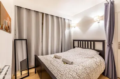 Un ou plusieurs lits dans un hébergement de l'établissement GuestReady - Quaint retreat in the heart of Paris