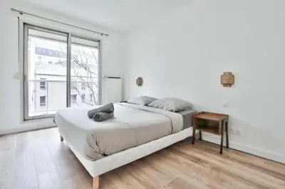 Un ou plusieurs lits dans un hébergement de l'établissement Appartement Quartier Panthéon Free Netflix