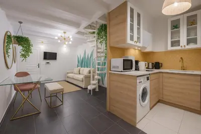 Cuisine ou kitchenette dans l'établissement LE LOUVRE - MONTORGEUIL Suites only ws