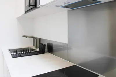 Cuisine ou kitchenette dans l'établissement Warm 18m ideal for couple in Paris