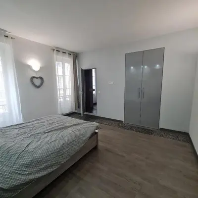 Un ou plusieurs lits dans un hébergement de l'établissement Appartement très lumineux porte de Saint-Cloud - F3 avec suite parentale