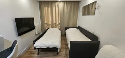 Télévision ou salle de divertissement dans l'établissement Studio T1 Cosy proche Paris et Stade de France