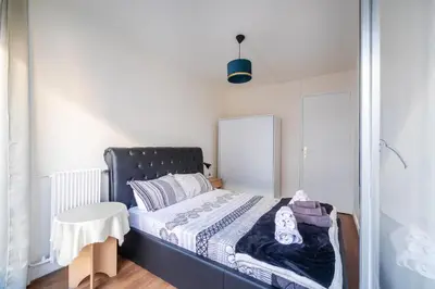 Un ou plusieurs lits dans un hébergement de l'établissement Appartement Glaciere