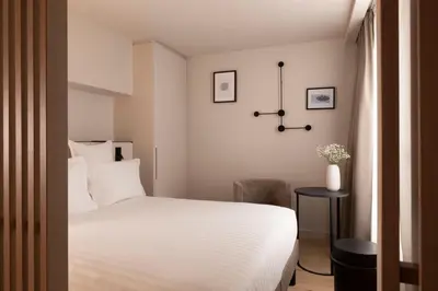 Un ou plusieurs lits dans un hébergement de l'établissement Hôtel Esté