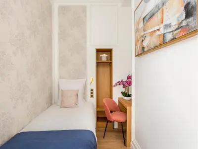 Un ou plusieurs lits dans un hébergement de l'établissement Merveil - Luxury Suite -ChampsElysees-Florentin II