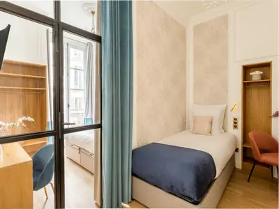 Un ou plusieurs lits dans un hébergement de l'établissement Merveil - Luxury Suite -ChampsElysees-Florentin II