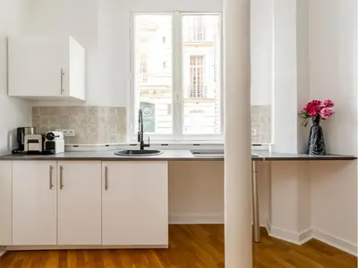 Cuisine ou kitchenette dans l'établissement Merveil - Family Suite - Champs Elysees - Monceau