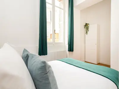 Un ou plusieurs lits dans un hébergement de l'établissement Merveil - Family Suite - Champs Elysees - Monceau
