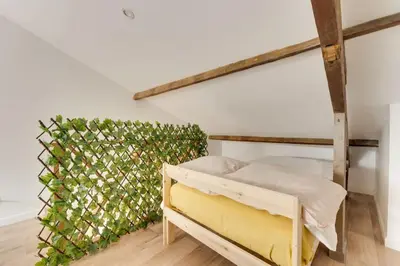 Un ou plusieurs lits dans un hébergement de l'établissement Duplex Moderne Cosy - Proche Porte d'Italie - Parking