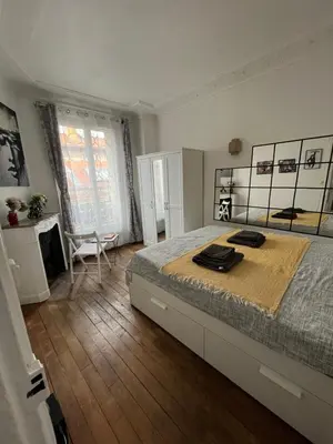 Un ou plusieurs lits dans un hébergement de l'établissement Nice 2 Rooms Full Appartement in Paris
