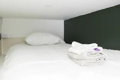 Un ou plusieurs lits dans un hébergement de l'établissement Nice studio - 2P - near Paris