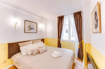 Un ou plusieurs lits dans un hébergement de l'établissement Suite Montorgueil - Hyper Centre Paris - Chatelet 3min