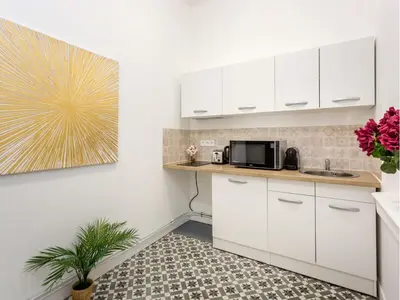 Cuisine ou kitchenette dans l'établissement Merveil - Family Suite - Marais - Martin III