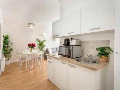 Cuisine ou kitchenette dans l'établissement Merveil - Family Suite - Marais - Martin IV