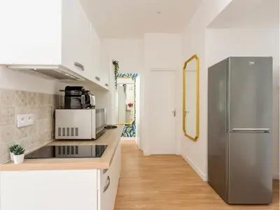 Cuisine ou kitchenette dans l'établissement Merveil - Family Suite - Marais - Martin IV