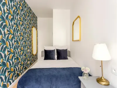 Un ou plusieurs lits dans un hébergement de l'établissement Merveil - Family Suite - Marais - Martin IV