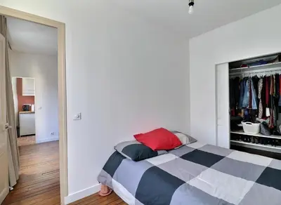 Un ou plusieurs lits dans un hébergement de l'établissement Sweet and cosy apartment near the Eiffel Tower, Roland Garros & PSG Stadium