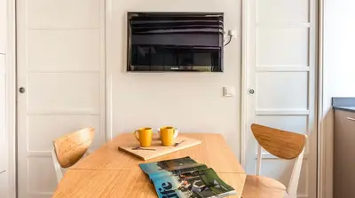Télévision ou salle de divertissement dans l'établissement The 199 - Charming apartment in the heart of Paris
