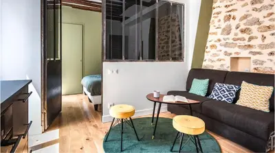Coin salon dans l'établissement The 199 - Charming apartment in the heart of Paris
