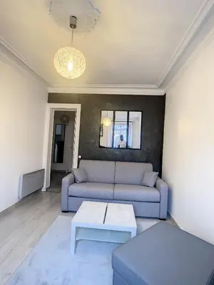Coin salon dans l'établissement Appartement Rénové & son Balcon Parisien