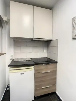 Cuisine ou kitchenette dans l'établissement Appartement Rénové & son Balcon Parisien